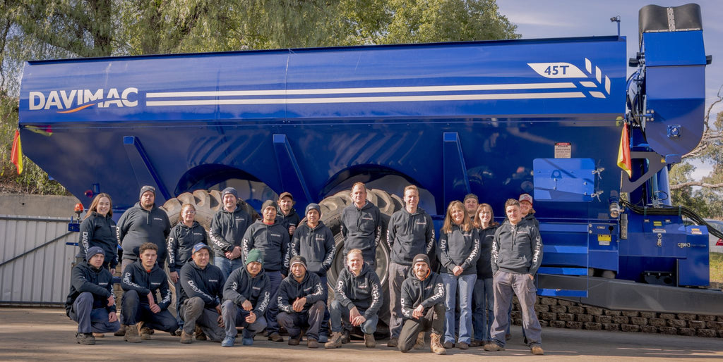 Davimac staff posing in front of 45t chaser bin